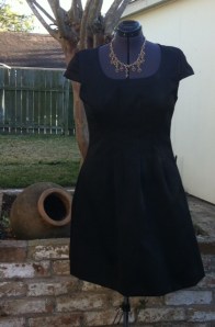 Completed dress pictured against the backyard ruins