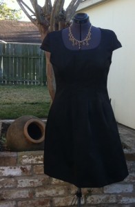 Completed dress pictured against the backyard ruins
